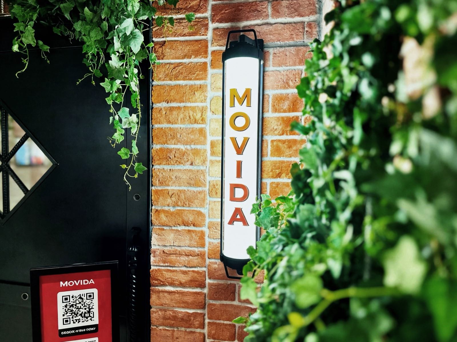 Movida Singapore at Raffles City, brick wall and sign, renovated by MD Projects